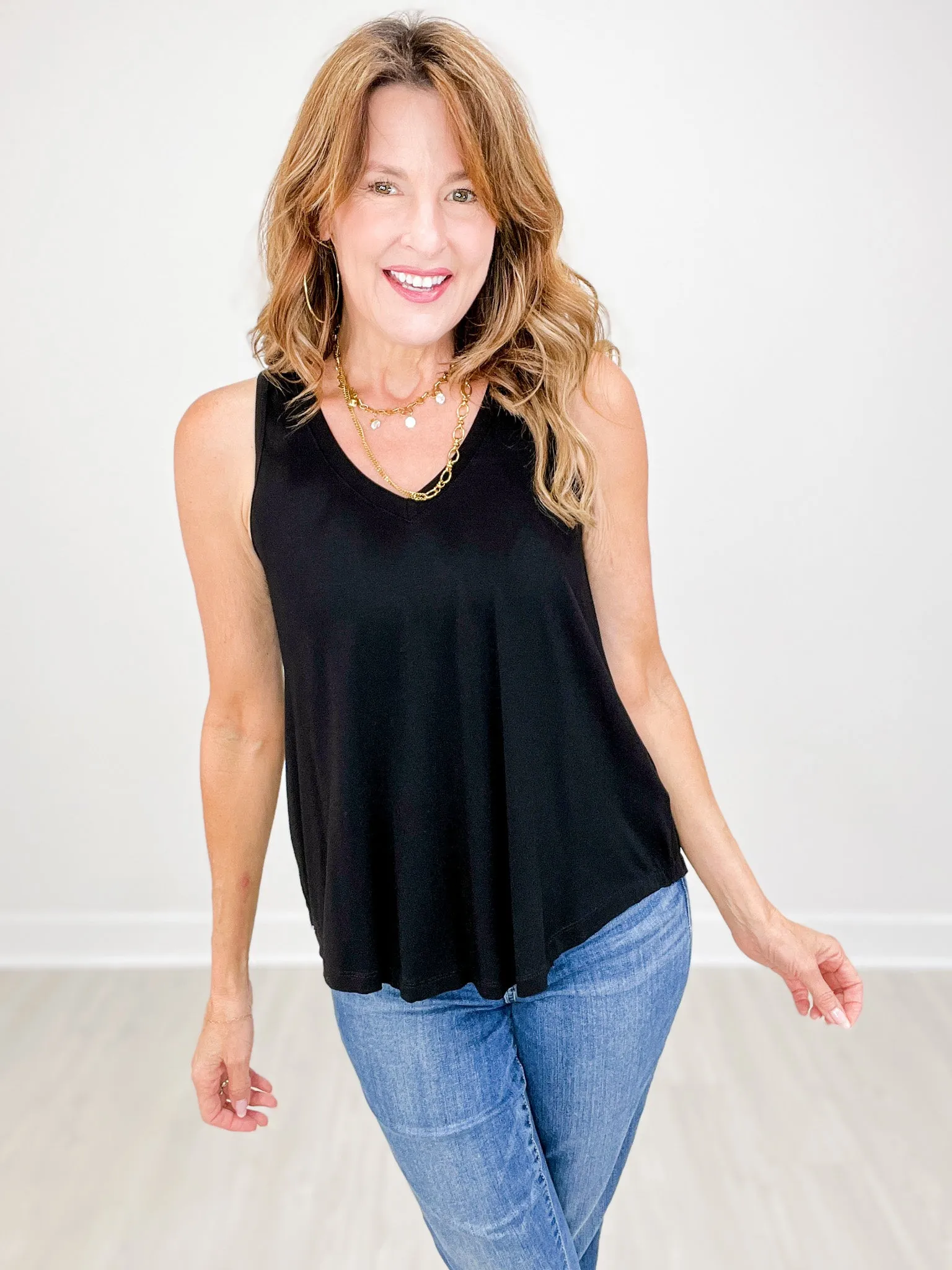 Sleeveless V-Neck Top with Rounded Hemline