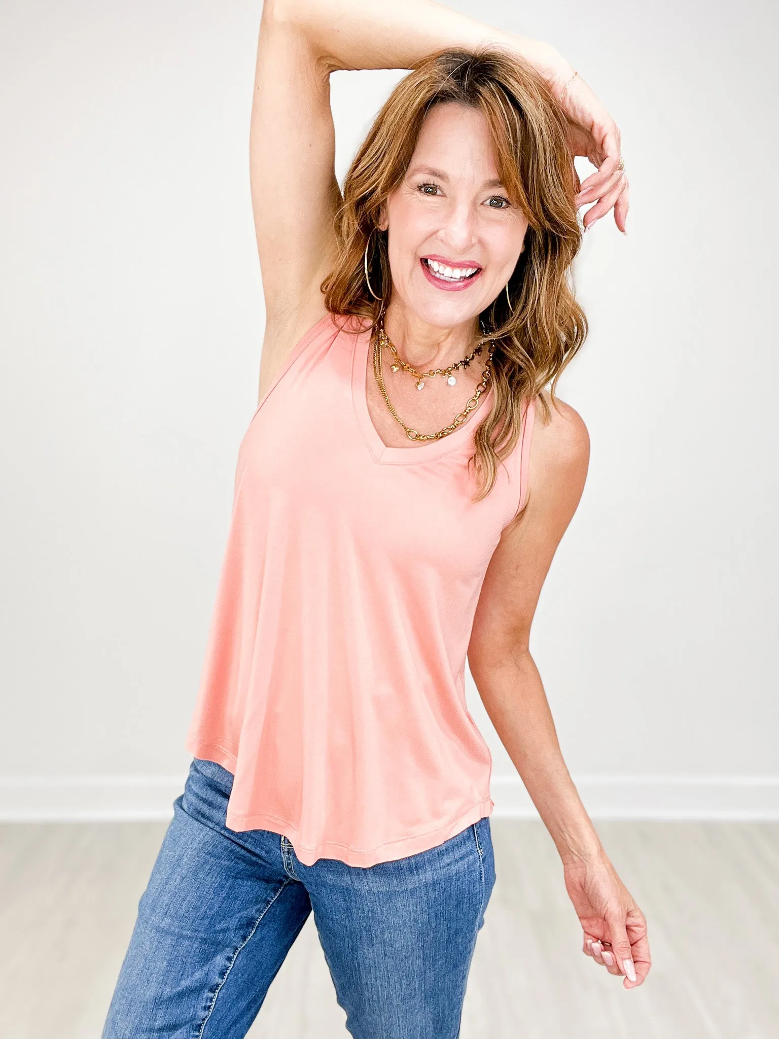 Sleeveless V-Neck Top with Rounded Hemline